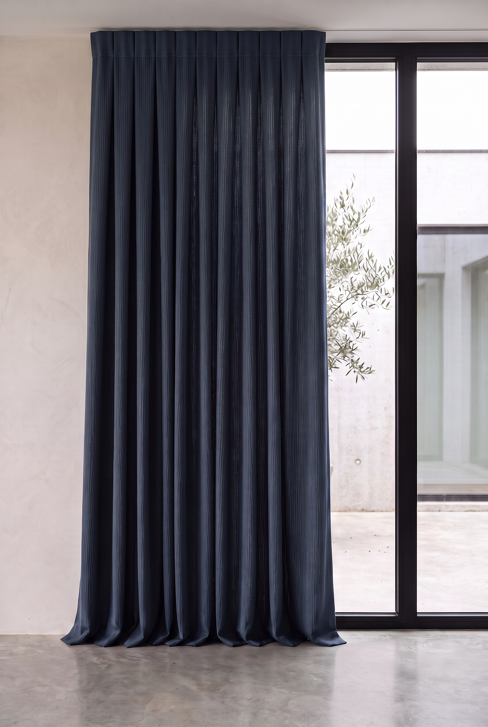 Midnight blue textured dimout curtain across a large window